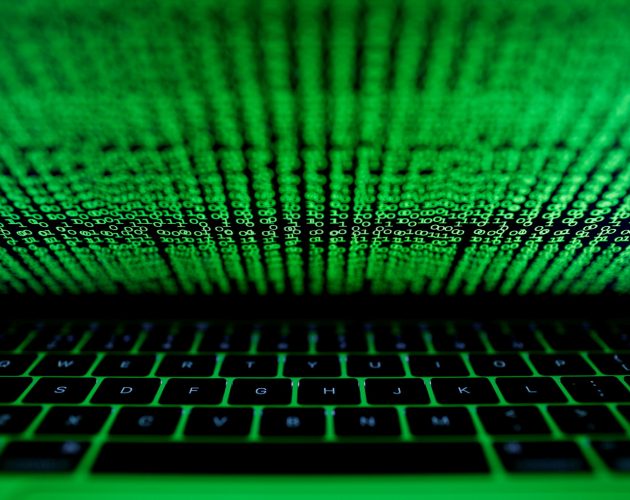 FILE PHOTO: A computer keyboard lit by a displayed cyber code is seen in this illustration picture taken on March 1,  2017. REUTERS/Kacper Pempel/File Photo